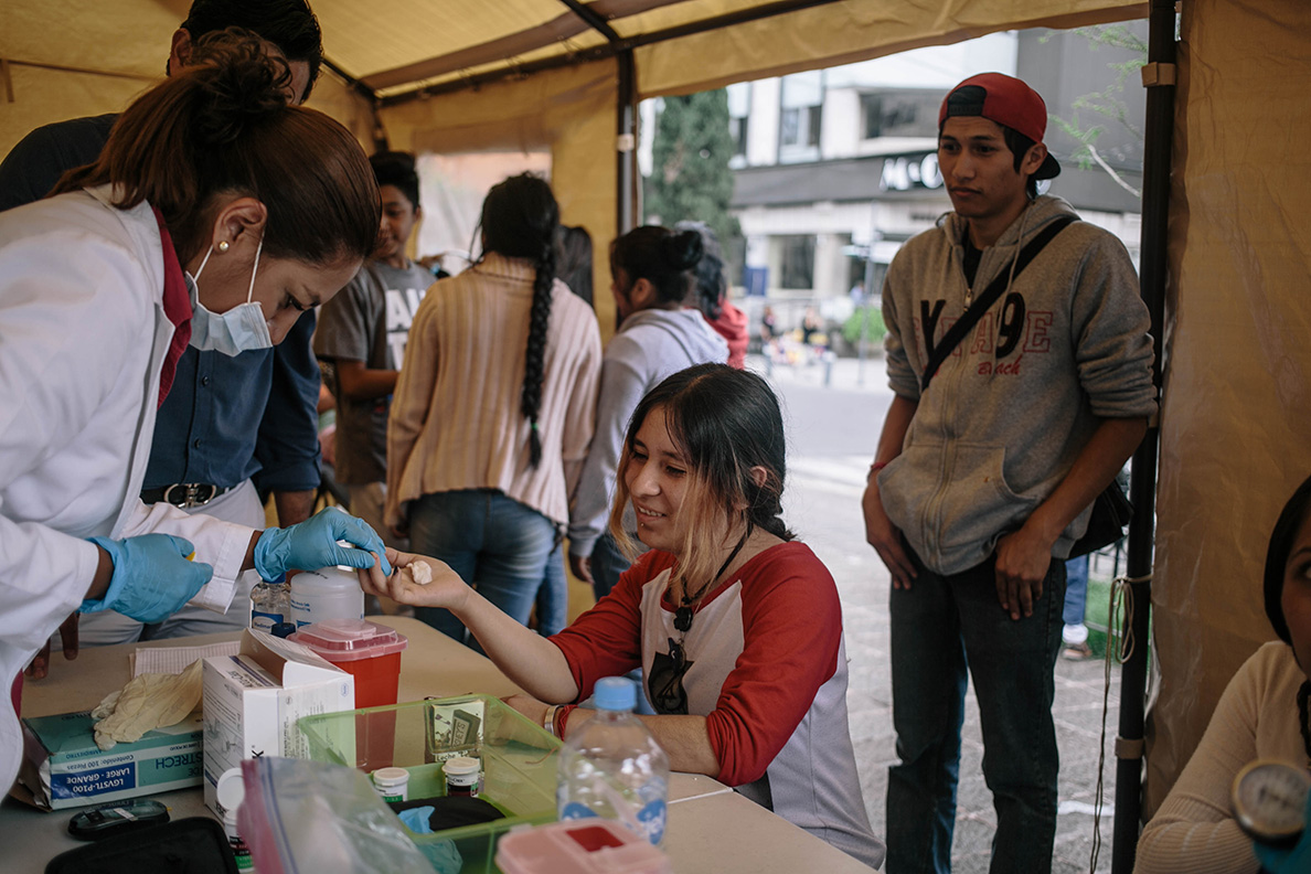 A women gets her blood glucose levels checked at a pop-up clinic in Mexico City's neighborhood of La Roma by Dr. Eduardo Juarez Oliveros. The clinic was set up by the Association Mexica de Diabetes (AMD) in partnership with Direct Relief. The clinic is aimed at serving populations in the city displaced by the earthquake, especially those with diabetes. (Photo by Meghan Dhaliwal for Direct Relief)